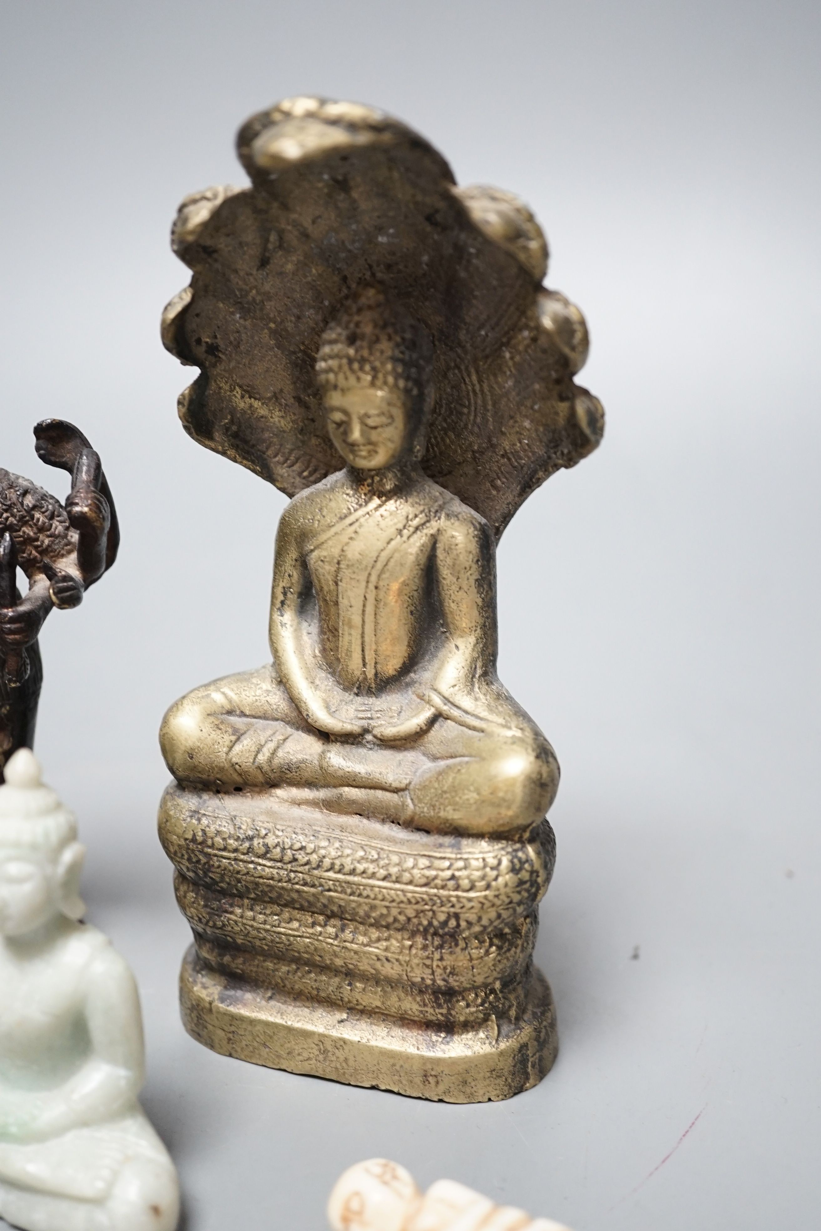 A quantity of Indian and South East Asian bronze and brass models of deities etc.